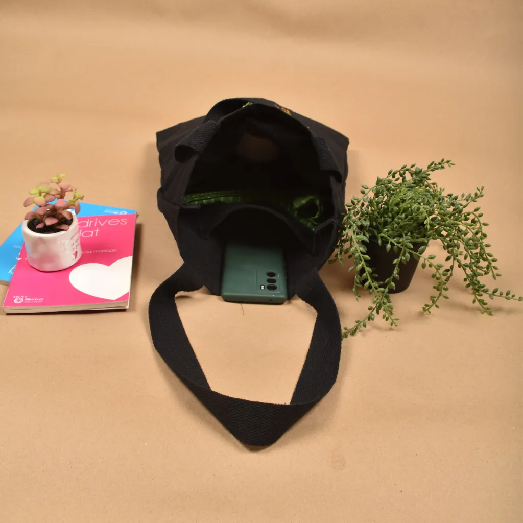Black canvas tote bag with heart embroidery