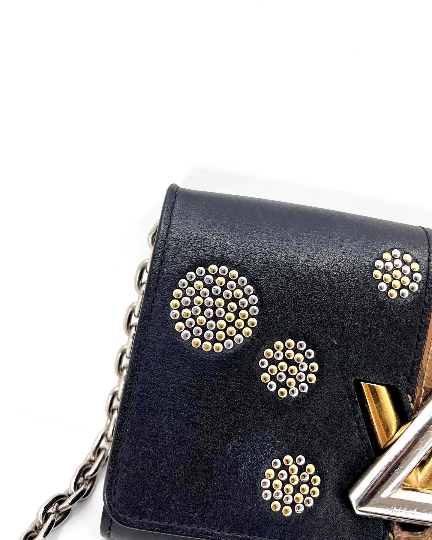 LOUIS VUITTON REVERSE MONOGRAM STUDDED NIGHT LIGHTS TWIST CALFSKIN CHAIN WALLET