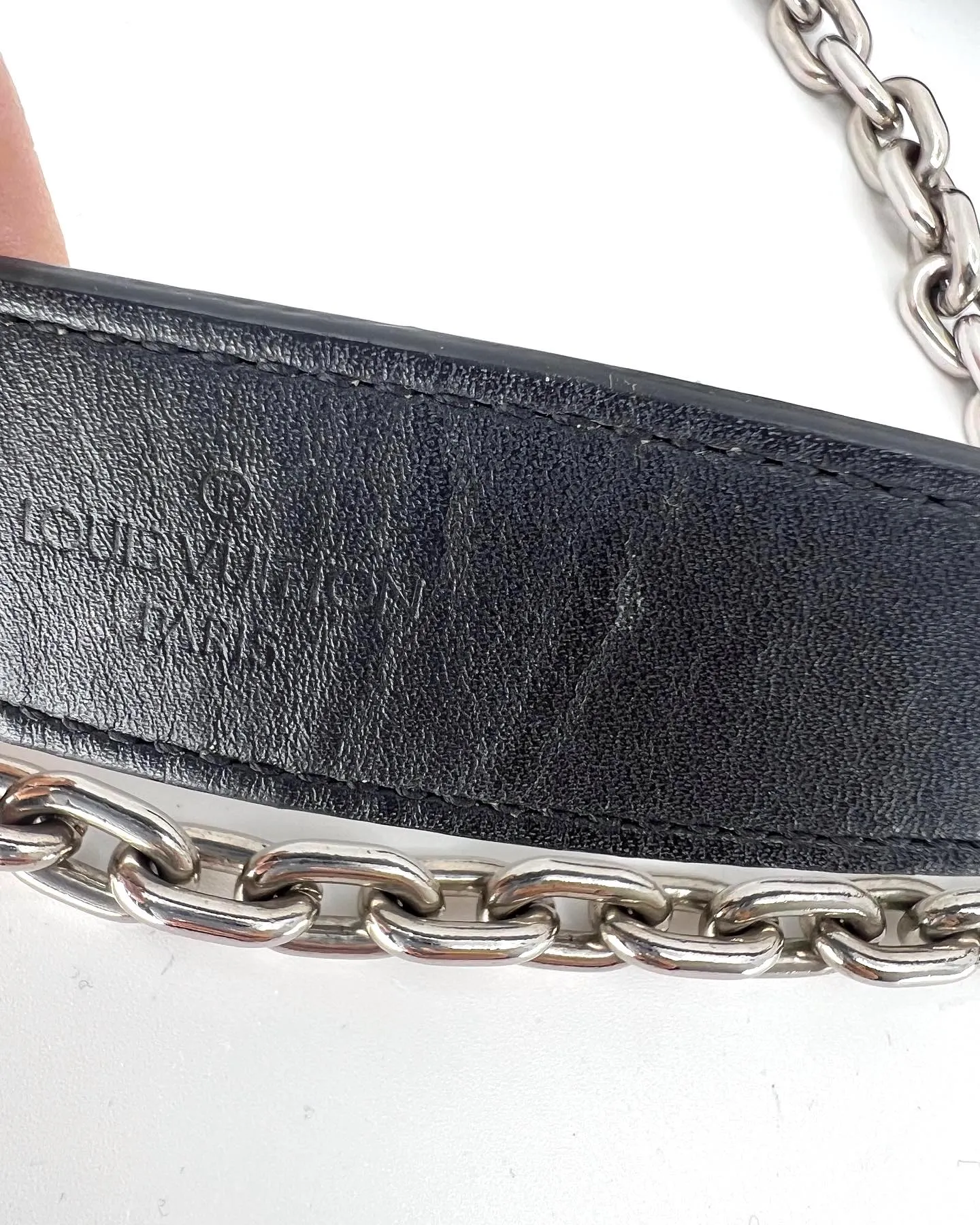 LOUIS VUITTON REVERSE MONOGRAM STUDDED NIGHT LIGHTS TWIST CALFSKIN CHAIN WALLET
