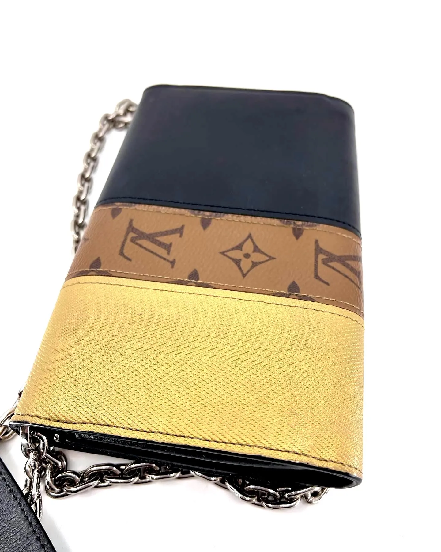 LOUIS VUITTON REVERSE MONOGRAM STUDDED NIGHT LIGHTS TWIST CALFSKIN CHAIN WALLET