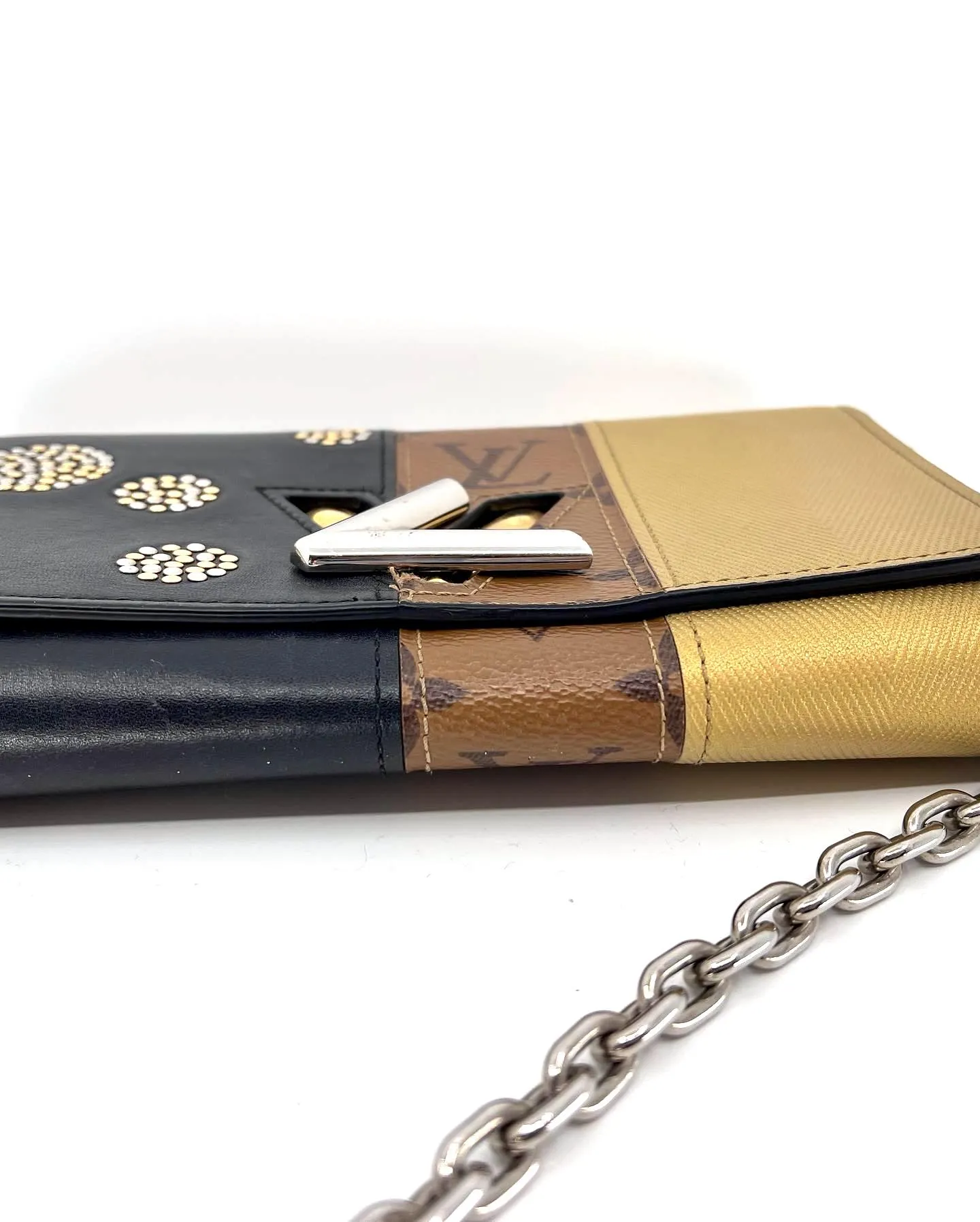 LOUIS VUITTON REVERSE MONOGRAM STUDDED NIGHT LIGHTS TWIST CALFSKIN CHAIN WALLET