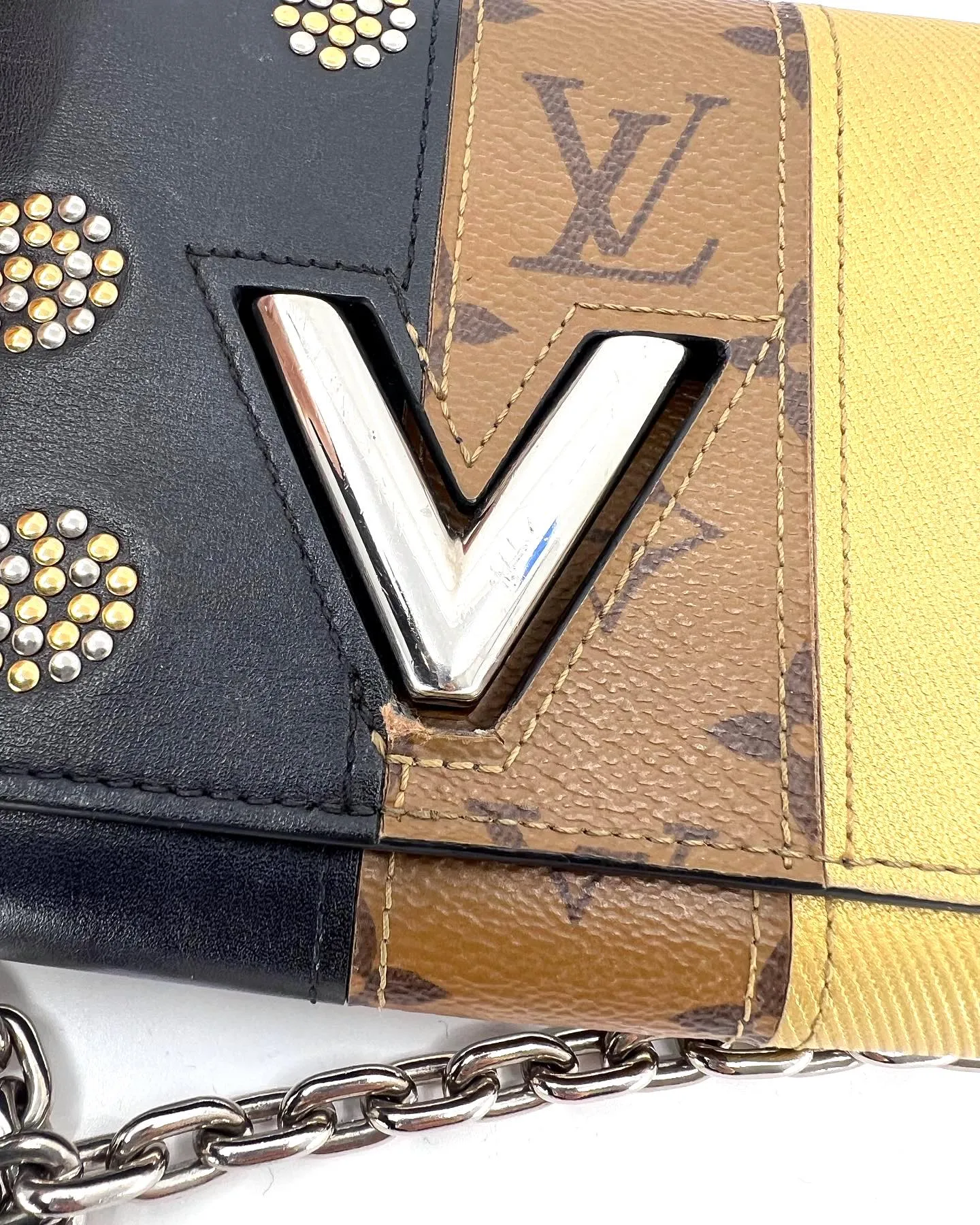 LOUIS VUITTON REVERSE MONOGRAM STUDDED NIGHT LIGHTS TWIST CALFSKIN CHAIN WALLET