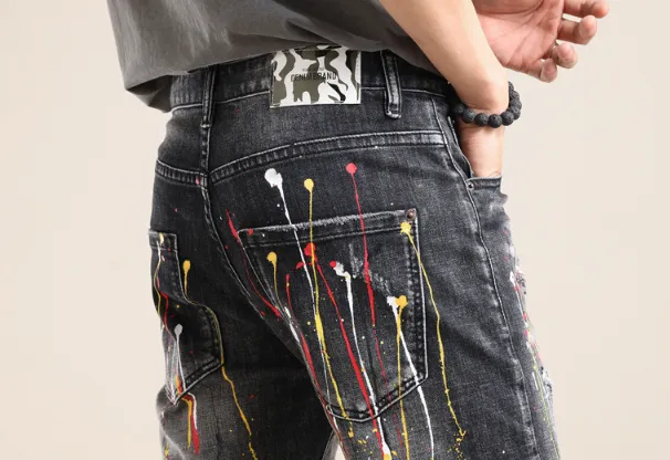 Yellow-painted distressed denim shorts