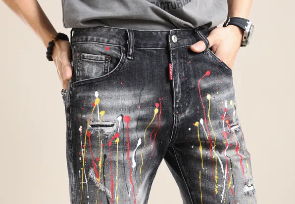 Yellow-painted distressed denim shorts